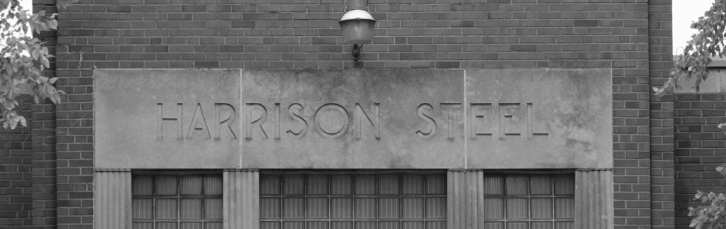 The old entrance with "Harrison Steel" carved into the building.