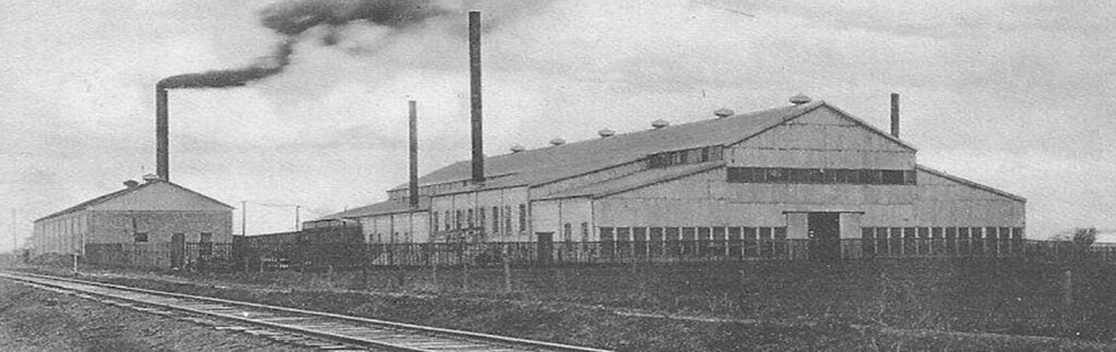 A black and white photo of the original Harrison Steel Castings Company location